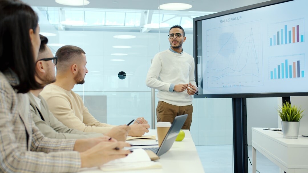 Professional workshop with people analyzing media content on screens