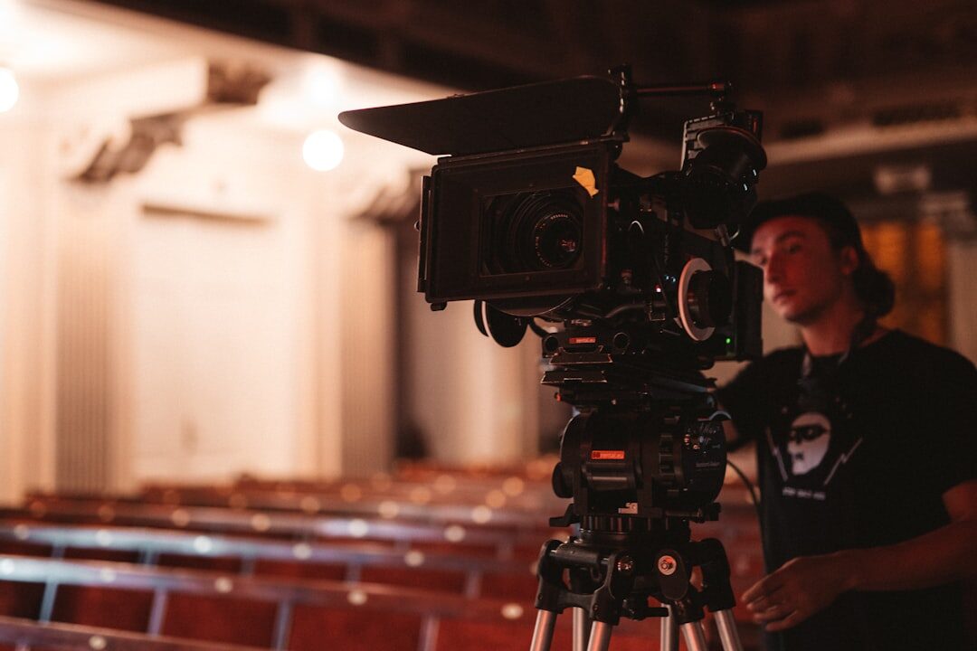 Journalist reporting on camera in a newsroom with equipment